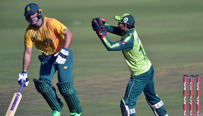 Pakistan´s Mohammad Rizwan (R) catches a ball as South Africa´s Pite van Biljon (L) runs between the wickets during the first Twenty20 international cricket match between South Africa and Pakistan at the Wanderers stadium in Johannesburg on April 10, 2021. — AFP