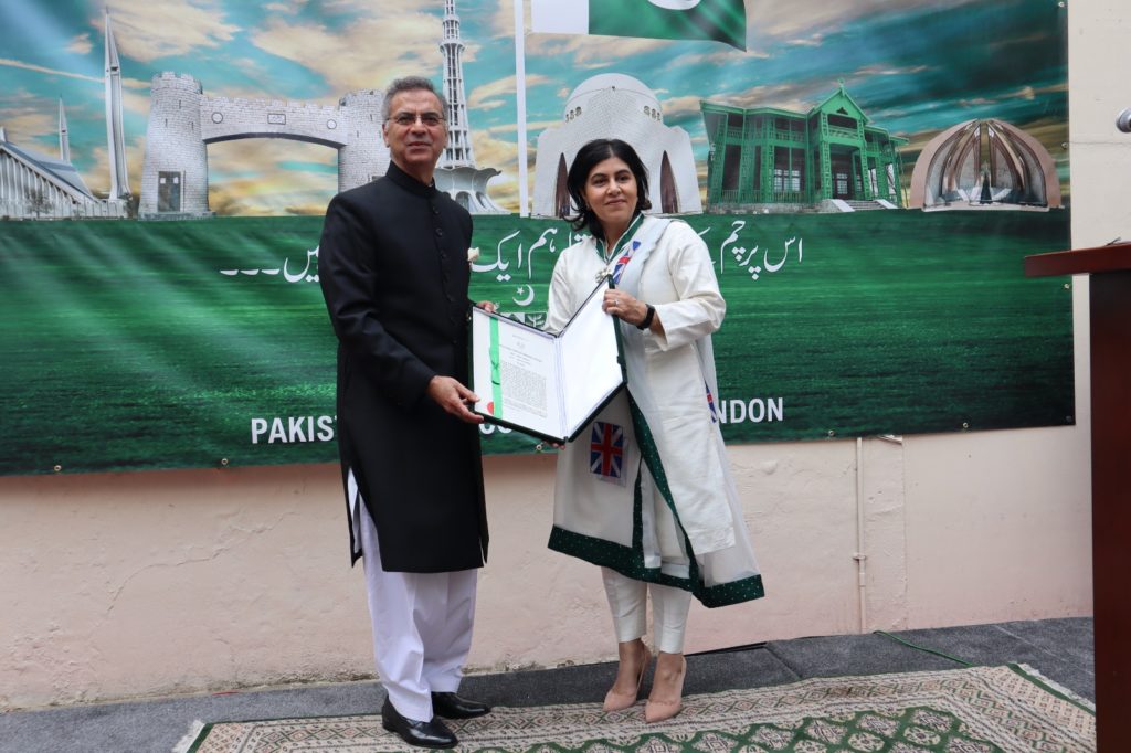 Pakistan High Commissioner to the UK, Moazzam Ahmad Khan conferring Sitara-e-Pakistan on Baroness Sayeeda Warsi at the Independence Day ceremony at Pakistan High Commission London