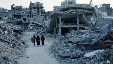 Palestinian walk amidst the rubble of buildings destroyed after an Israeli strike, in Khan Younis, in the southern Gaza Strip on Sept 1, 2024. Image via Reuters