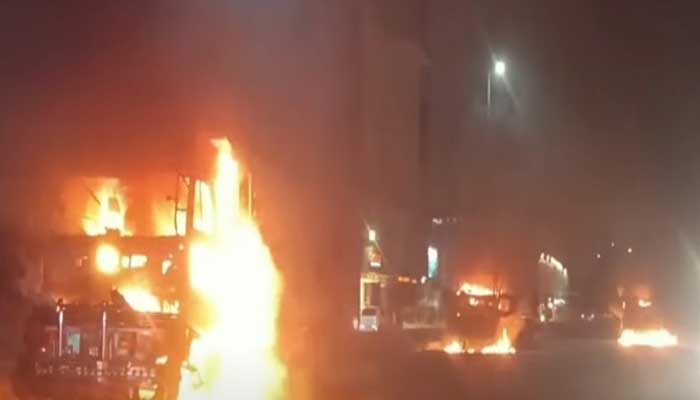 Mob sets trucks ablaze after Karachi road accident kills siblings